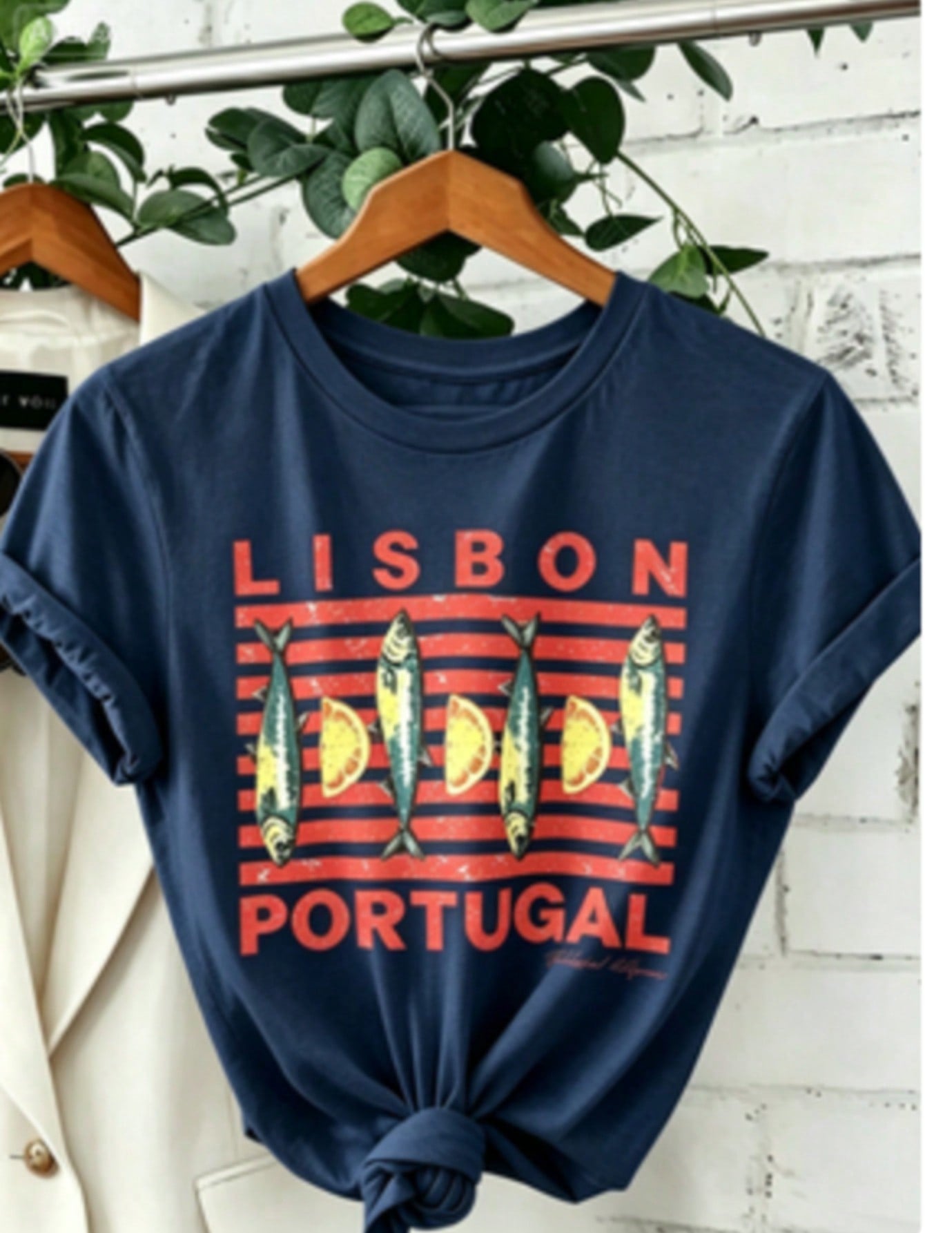 Soft Breathable "Wo" Lisbon Portugal Pattern Printed T-Shirt | Vibrant Tile Art And Tram Design, Paired With Canned Sardines And Lisbon Portuguese Letters, A Lightweight Short-Sleeved Round-Neck Casual Top, Regular Fit H-Line, Machine Washable For Year-Ro