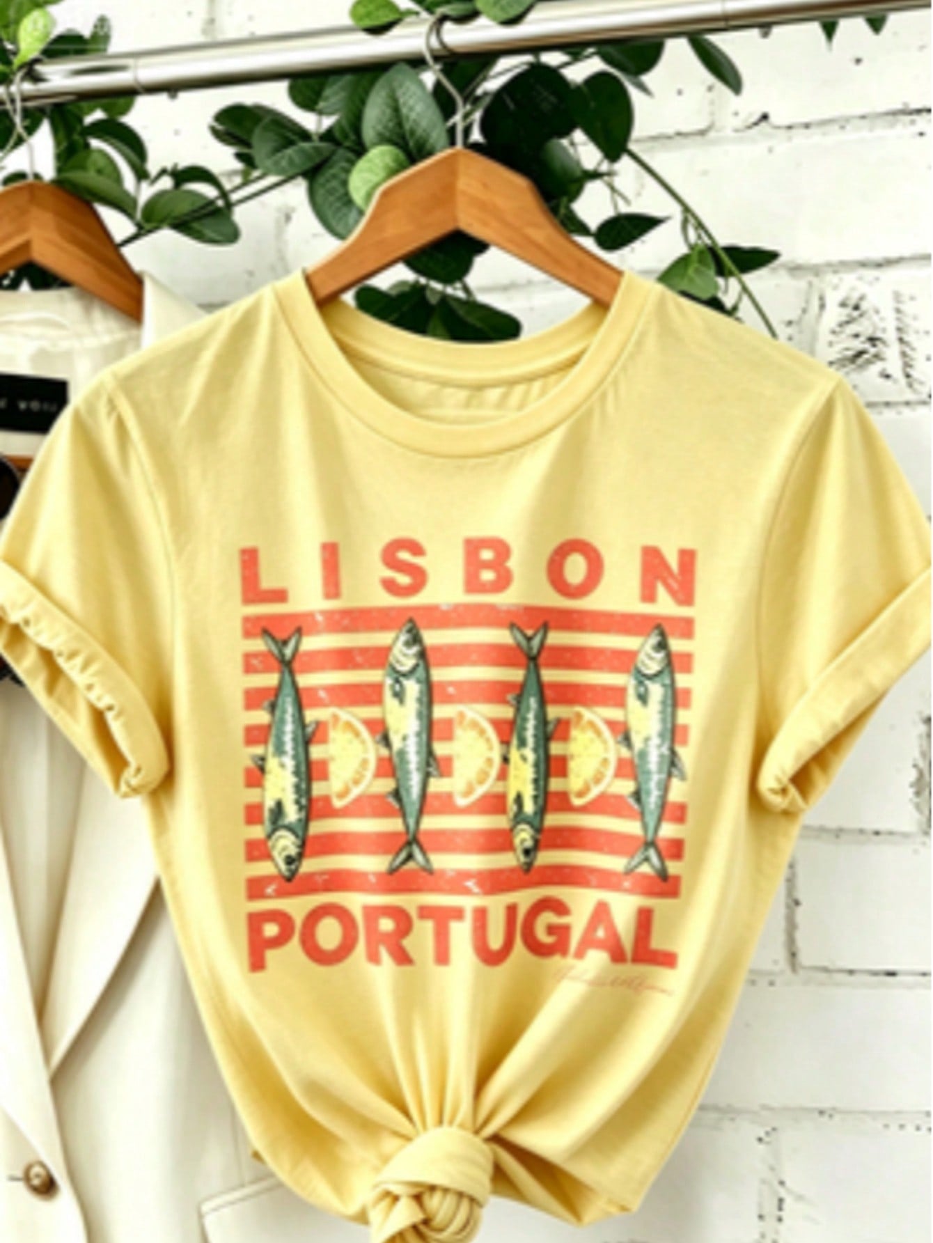 Soft Breathable "Wo" Lisbon Portugal Pattern Printed T-Shirt | Vibrant Tile Art And Tram Design, Paired With Canned Sardines And Lisbon Portuguese Letters, A Lightweight Short-Sleeved Round-Neck Casual Top, Regular Fit H-Line, Machine Washable For Year-Ro