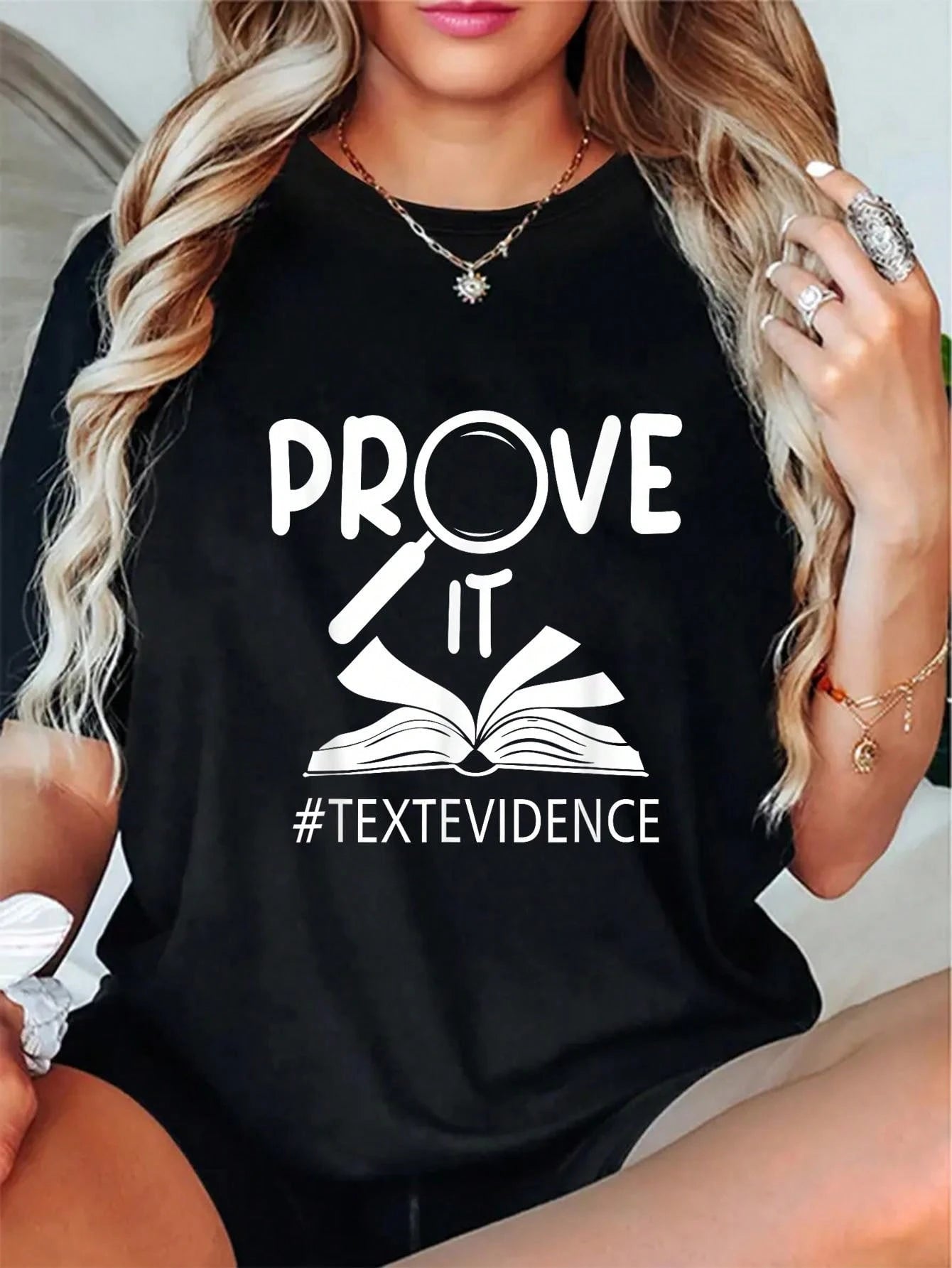 Soft round neck lightweight tee printed with literacy teacher slogan, comfy back-to-school outfit and cute gift for reading educators